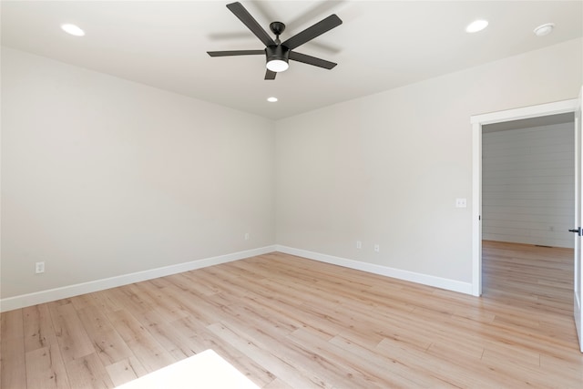 unfurnished room with ceiling fan and light hardwood / wood-style floors