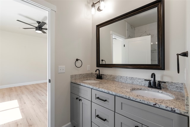 bathroom featuring vanity, ceiling fan, and hardwood / wood-style flooring