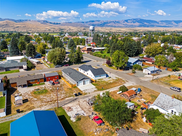 birds eye view of property with a mountain view