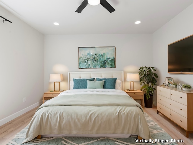 bedroom featuring light wood-type flooring and ceiling fan