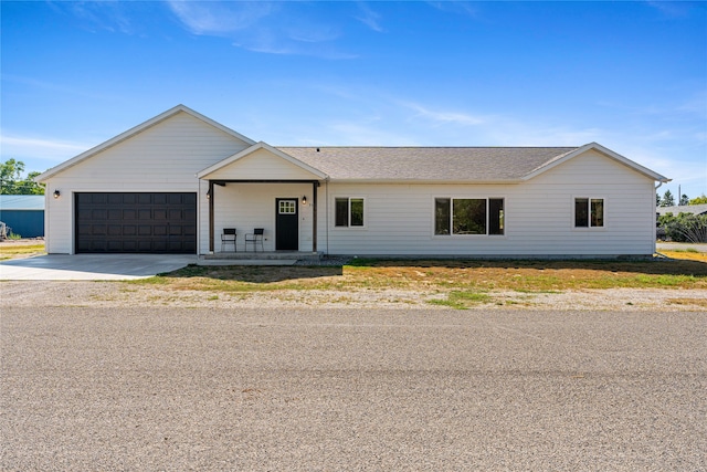 view of front facade featuring a garage and covered porch