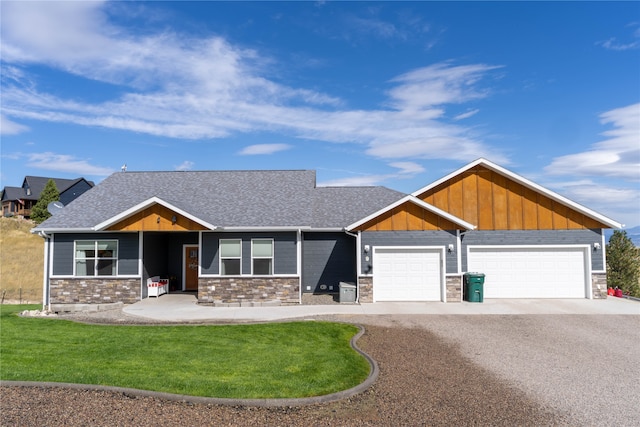 view of front facade with a garage and a front yard