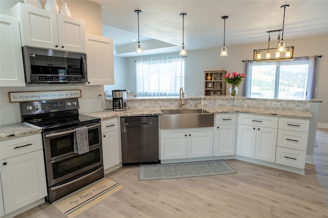 kitchen with sink, appliances with stainless steel finishes, and white cabinetry