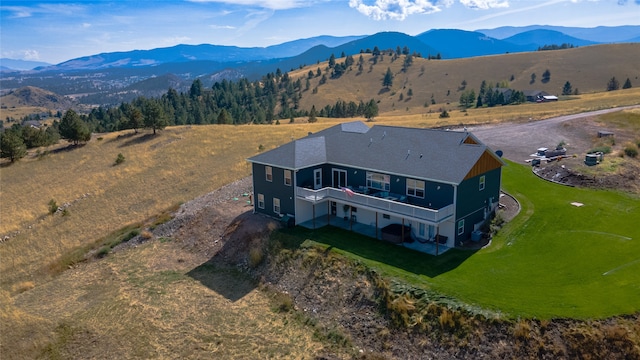 birds eye view of property with a mountain view