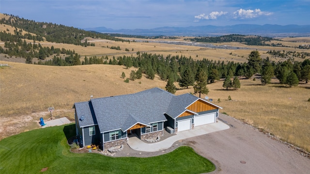 drone / aerial view featuring a rural view and a mountain view