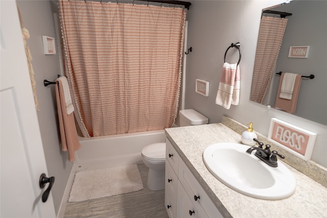 full bathroom featuring shower / bathtub combination with curtain, toilet, and vanity