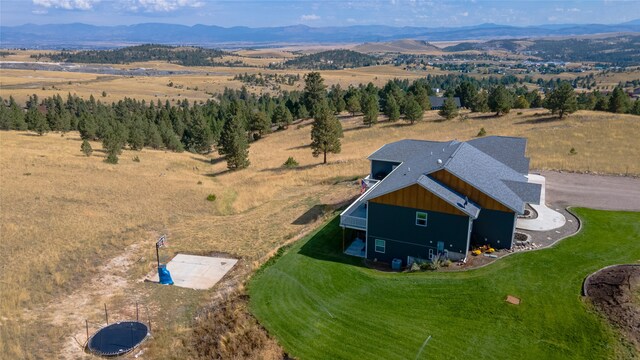 drone / aerial view featuring a mountain view and a rural view