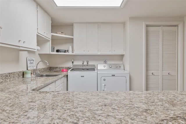 2100 Four Mile Way, Kalispell, MT 59901 - kitchen featuring washer and dryer, light countertops, white cabinets, and open shelves
