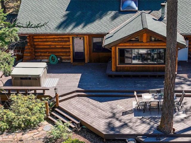 2100 Four Mile Way, Kalispell, MT 59901 - deck with a jacuzzi and outdoor dining space