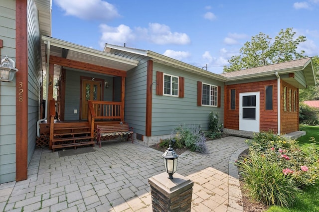 rear view of property featuring a patio