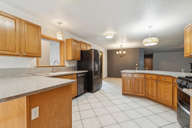 kitchen with pendant lighting, double oven range, a peninsula, light countertops, and dishwashing machine