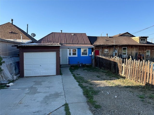 1327 Farrell St, Butte, MT 59701 - ranch-style house featuring a garage, metal roof, driveway, and fence