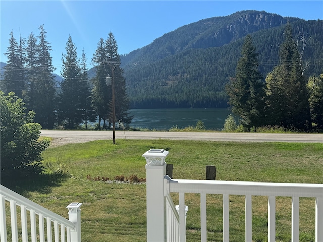 property view of mountains with a water view and a wooded view