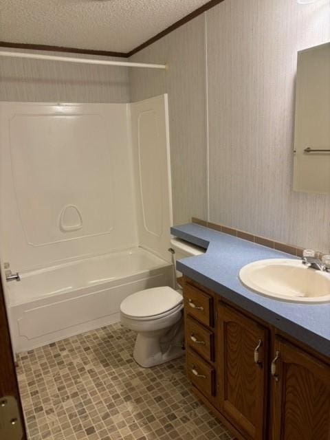 bathroom featuring vanity,  shower combination, ornamental molding, a textured ceiling, and toilet