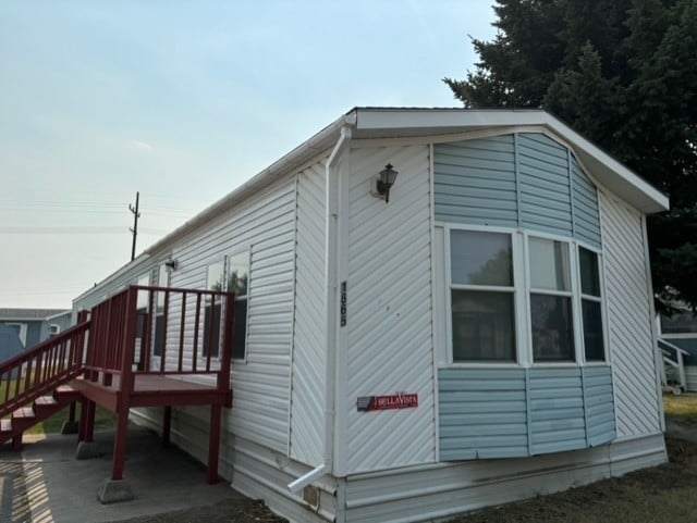 view of property exterior featuring stairway