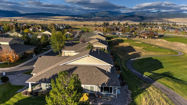 birds eye view of property featuring a mountain view