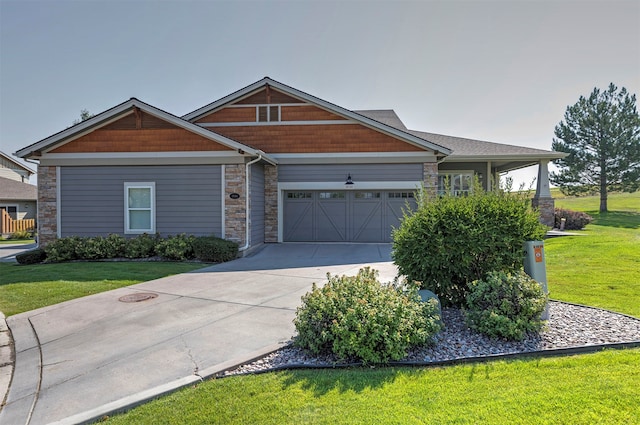 craftsman inspired home featuring a garage and a front yard