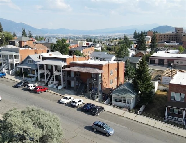 birds eye view of property featuring a mountain view