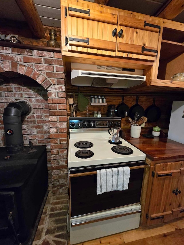 kitchen with white range with electric cooktop and a wood stove