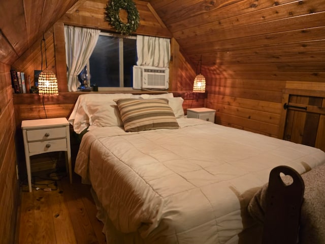 bedroom featuring wood walls, hardwood / wood-style flooring, wooden ceiling, and vaulted ceiling