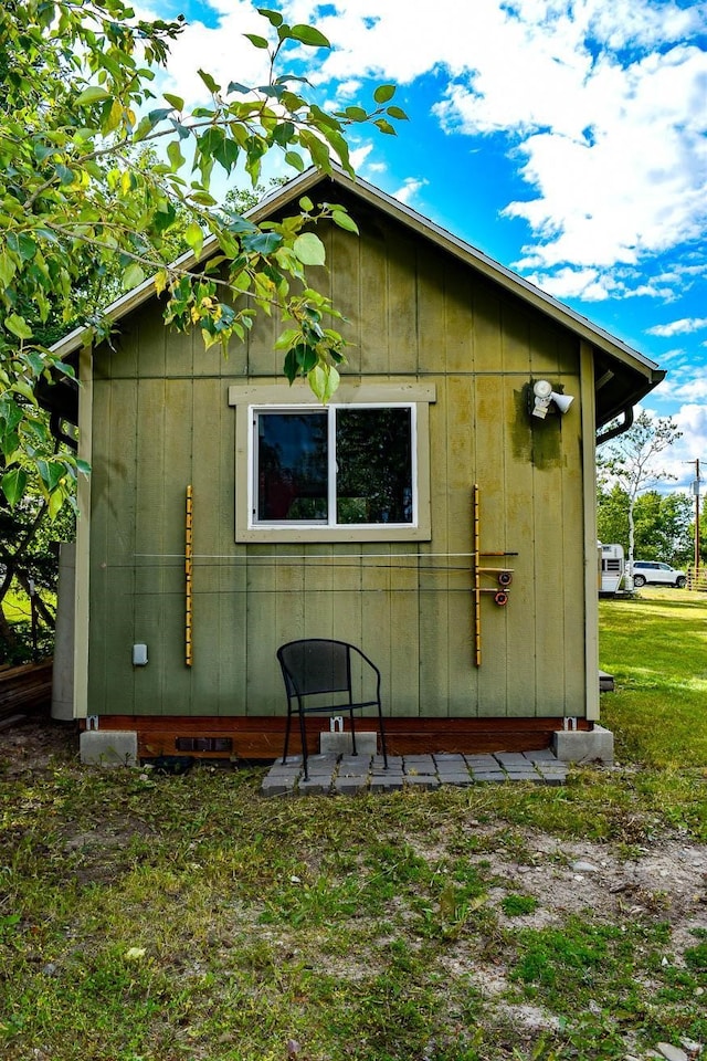 view of side of home featuring a lawn