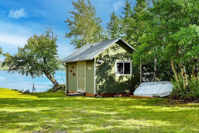 view of outdoor structure with a lawn