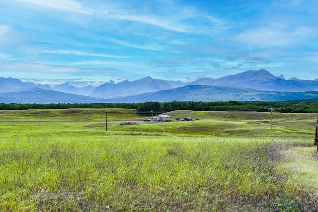 view of mountain feature with a rural view