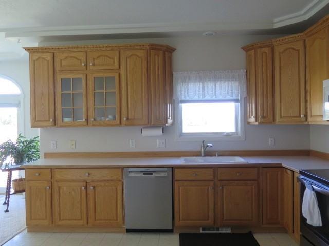 kitchen with a sink, black range with electric cooktop, dishwasher, and a healthy amount of sunlight