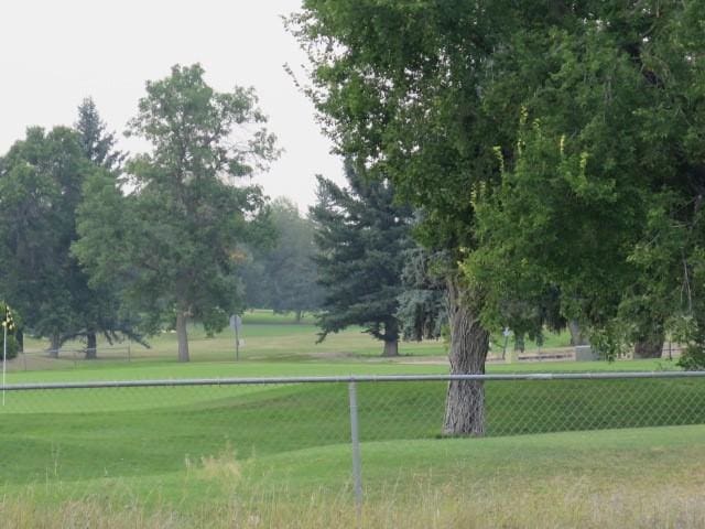 view of property's community with a lawn