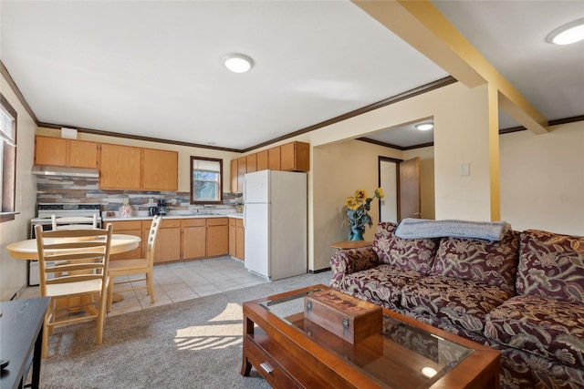 living area featuring light tile patterned floors, light carpet, and ornamental molding