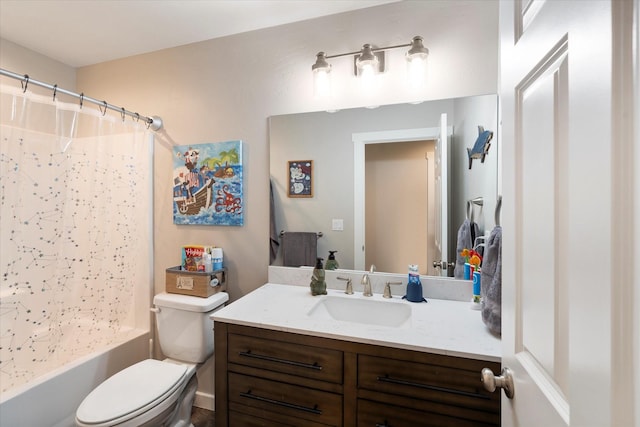 full bathroom with vanity, shower / tub combo, and toilet