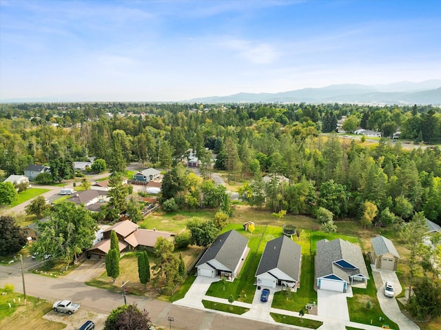 birds eye view of property with a mountain view and a residential view