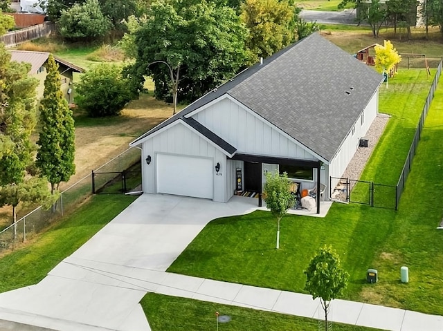 view of front of house with board and batten siding, a shingled roof, a gate, and a garage