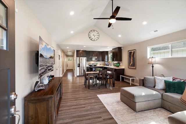 living room featuring visible vents, high vaulted ceiling, recessed lighting, a ceiling fan, and dark wood finished floors