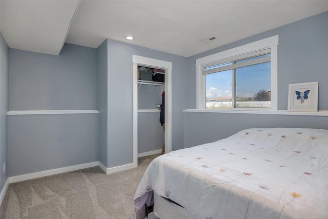 carpeted bedroom featuring a closet, visible vents, recessed lighting, and baseboards