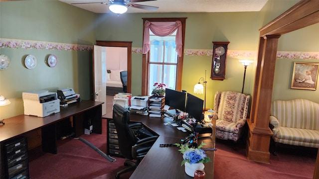 carpeted home office featuring ceiling fan