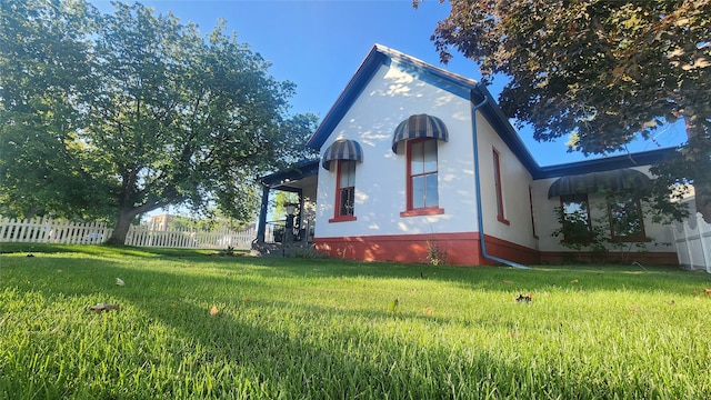 view of home's exterior featuring a lawn