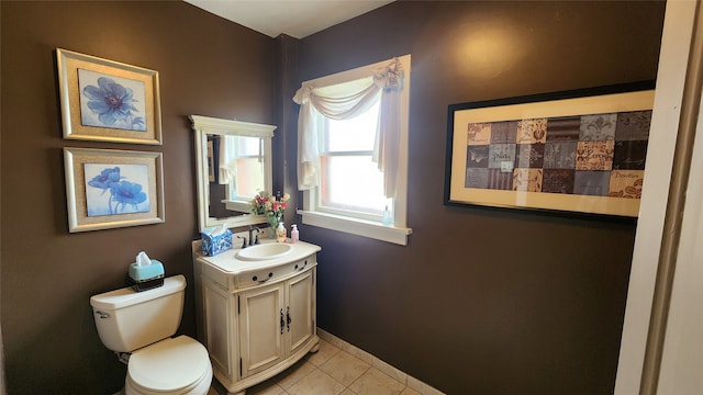 bathroom with vanity, toilet, and tile patterned floors