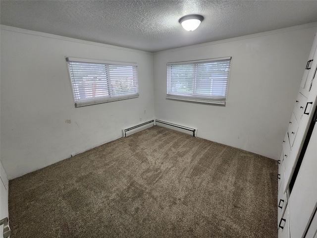 unfurnished room with a textured ceiling, baseboard heating, and carpet flooring