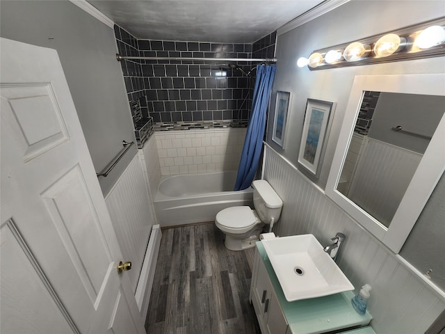 full bathroom with hardwood / wood-style floors, toilet, vanity, crown molding, and shower / tub combo with curtain