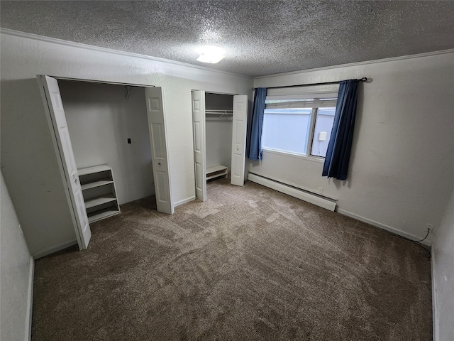 unfurnished bedroom with multiple closets, a baseboard radiator, carpet, and a textured ceiling