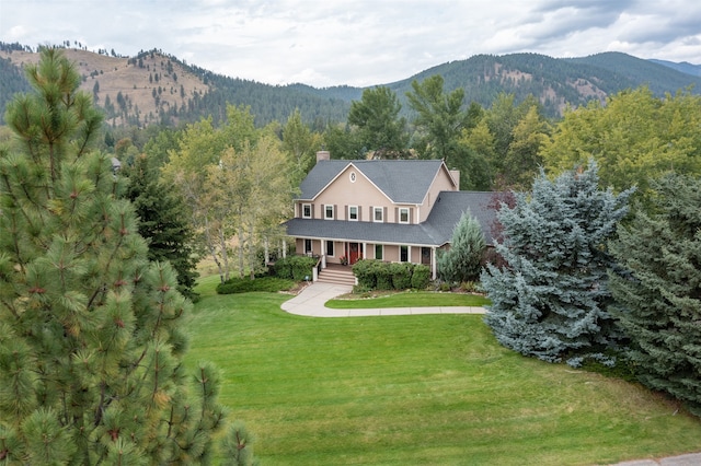 birds eye view of property featuring a mountain view