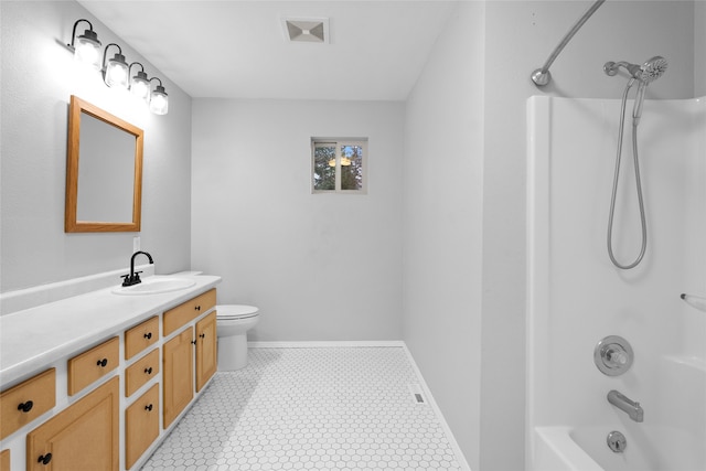 bathroom with tile patterned floors, vanity, and toilet