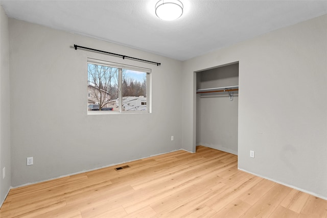 spare room featuring light wood-type flooring