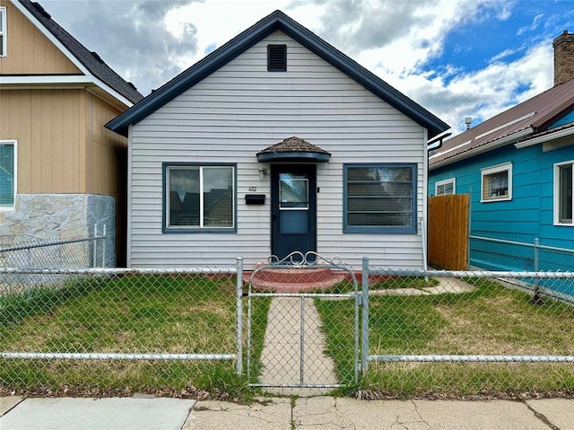 view of front of home with a fenced front yard and a front yard