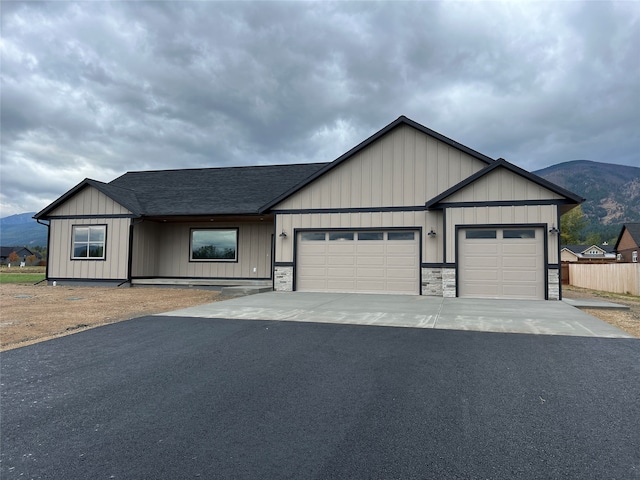 view of front of house with a mountain view and a garage