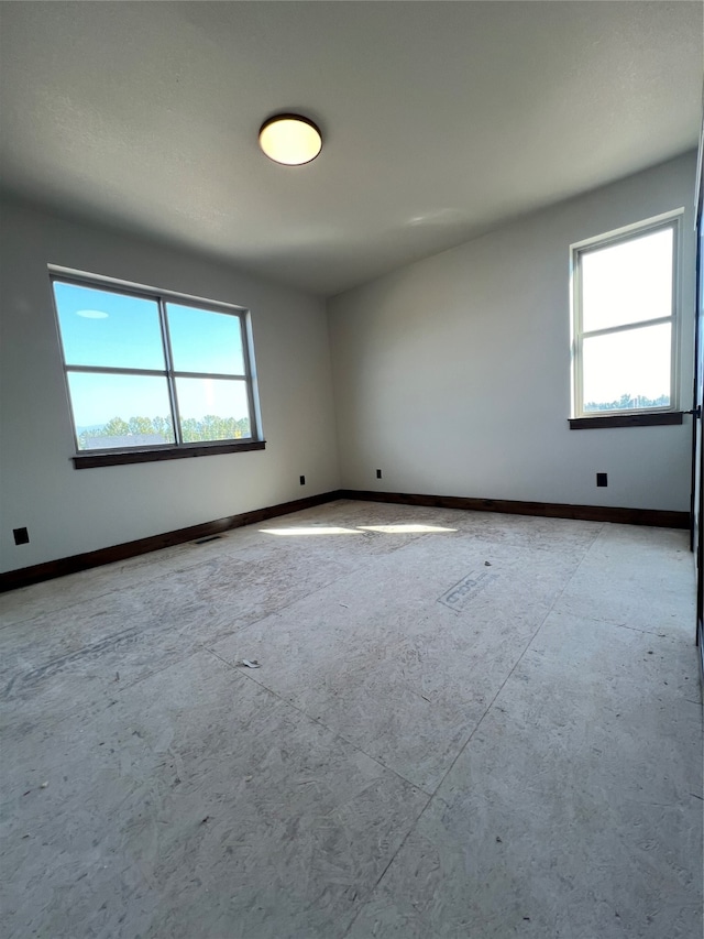 spare room featuring a healthy amount of sunlight