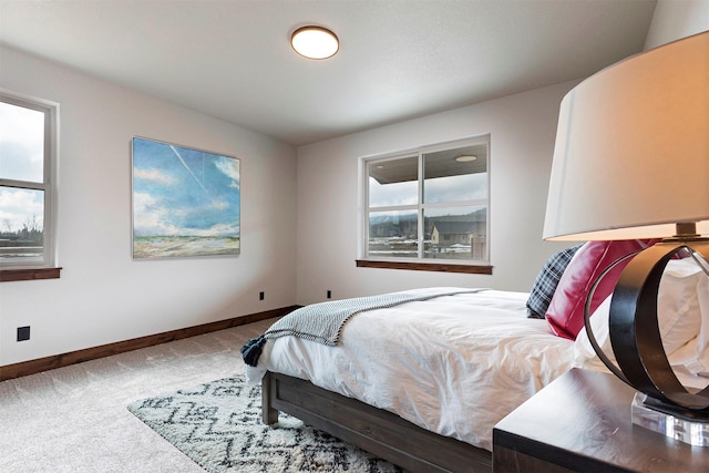 bedroom with carpet flooring and baseboards