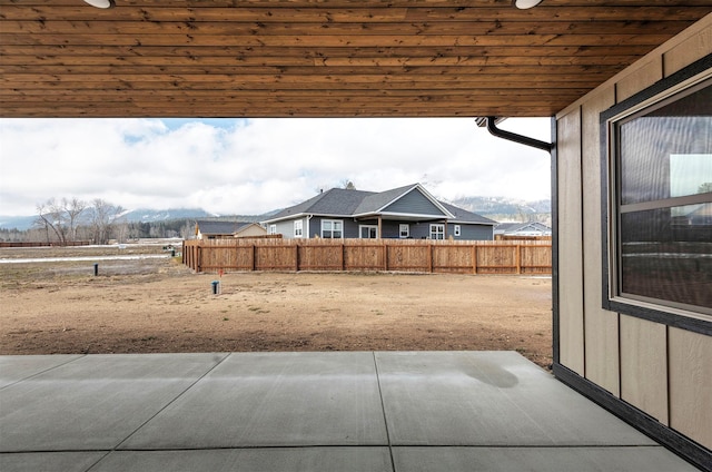 view of yard with fence and a patio