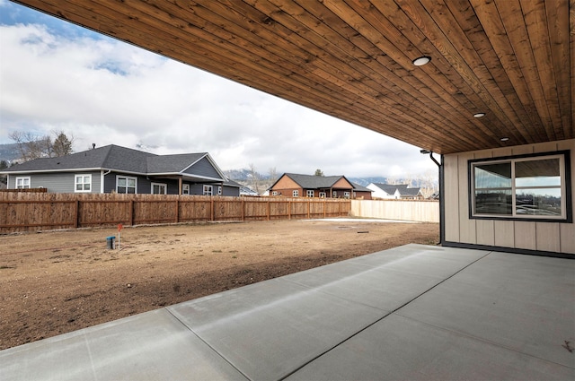 view of yard with a fenced backyard and a patio